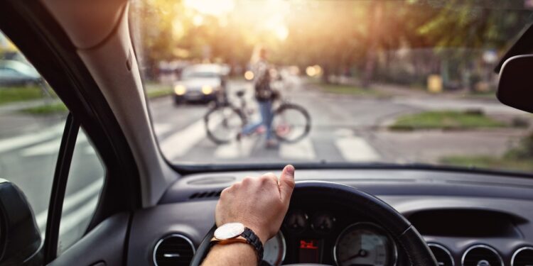 bicycle passes through pedestrian strips in city